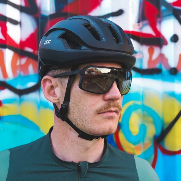 Male cyclist wearing gold mirror cycling glasses.